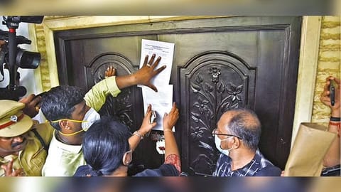 Revenue officials sealing the building following protests