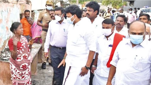 Minister Anbil Mahesh Poyyamozhi inspecting houses ravaged by fire in Thanjavur on Tuesday