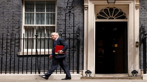 British Prime Minister Boris Johnson walks at Downing Street