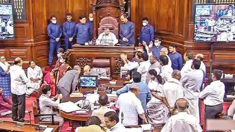 Opposition members protest in the Rajya Sabha during the ongoing Monsoon Session