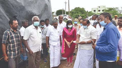Food Minister R Sakkarapani inspecting an open godown in Tiruvarur on Friday