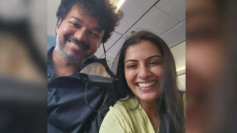Actor Vijay with actress Varalaxmi Sarathkumar