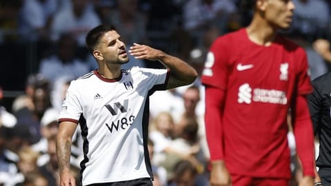 Fulham's Aleksandar Mitrovic celebrates scoring their second goal as Liverpool's Virgil van Dijk looks on Action