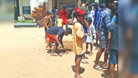 Youngsters filling up the pit dug for bhoomi pooja.
