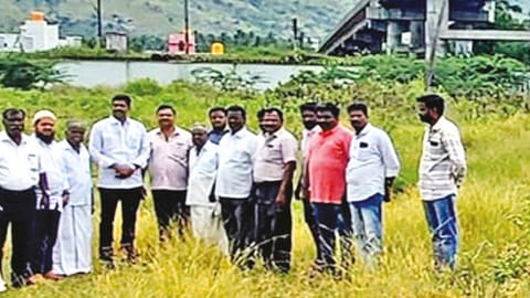 AIADMK MLA G Senthil Kumar and other officials inspecting the unfinished bridge in Vaniyambadi