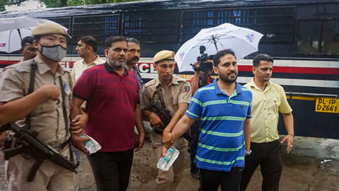 General Secretary of PFI Anis Ahmed (second, right) being produced to Patiala Court