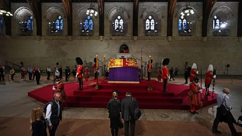 Members of the public file past the coffin of queen Elizabeth II, inside Westminster Hall, at the Palace of Westminster, in London