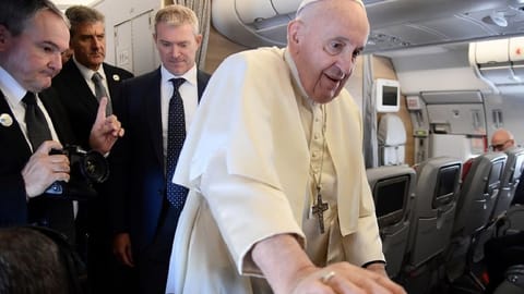 Pope greeting the media