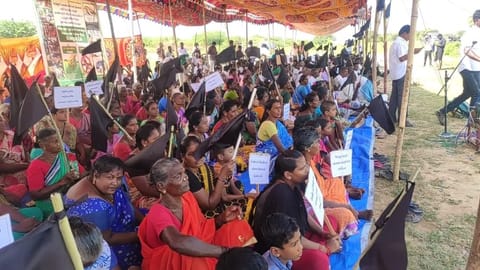 Villagers with black flags in one-day hunger strike