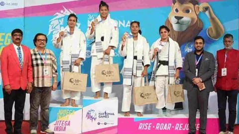 Judo medallists pose with their winnings on Sunday