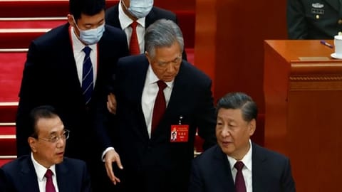 Hu Jintao being escorted out