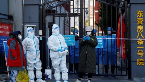 China shortens COVID quarantine times, eases flight curbs