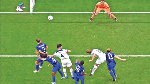 England forward Harry Kane heads the ball as USA?s goalkeeper Matt Turner looks on