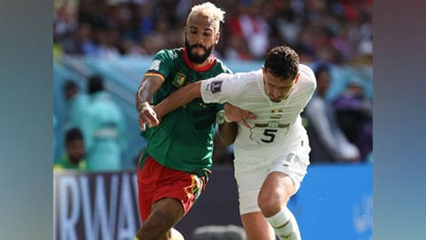 Serbia and Cameroon team players in action.