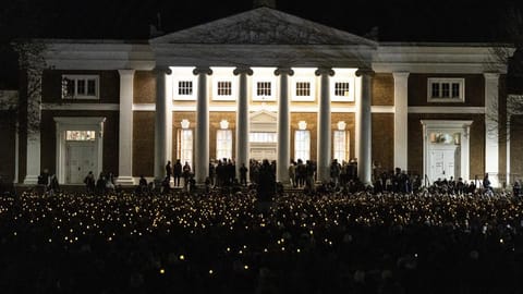 University of Virginia students participate in a vigil in response to shootings that happened on campus the night before in Charlottesville, Va.