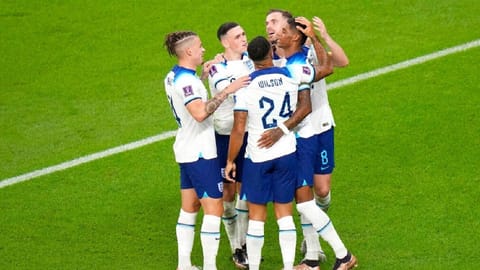 England's Marcus Rashford, right, celebrates with teammates after scoring his side's third goal