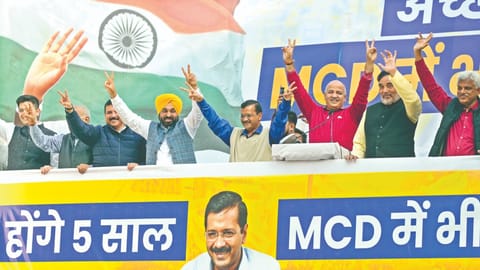 Kejriwal with Mann, Sisodia, at the party HQ after their win