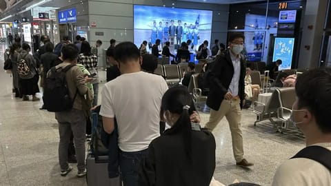 Passengers prepare to board a flight at the airport in north-central China's Jiangxi province.