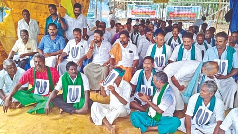 Sugarcane farmers on waiting protest in Thanjavur on Monday.