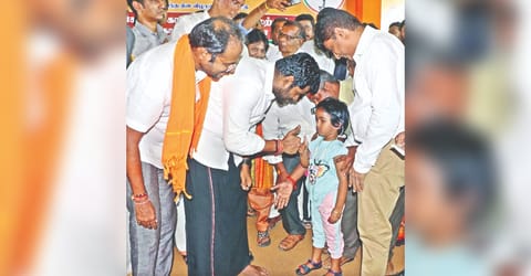 BJP state president K Annamalai greeting a child at a party function in Coimbatore on Wednesday