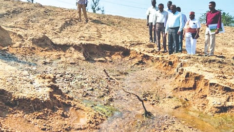 Collector D Baskara Pandian and PWD officials inspecting the renovated spring channel near Ocheri on the Ranipet - Kancheepuram border