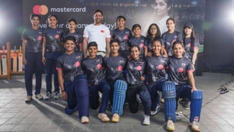 Mahendra Singh Dhoni with a group of aspiring under-19 women cricketers