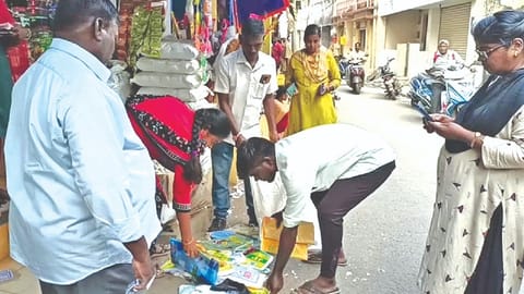 Officials seize plastic bags from shops in Bazar Street in Chengalpattu on Tuesday