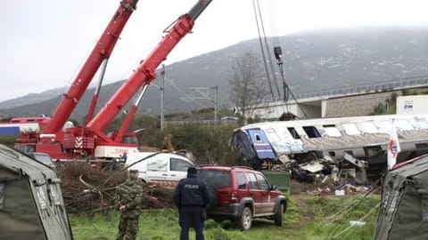 Cranes remove debris after a collision in Temple