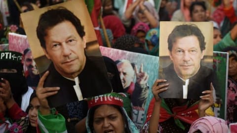 Supporters of Pakistan's former prime minister Imran Khan, carry placards displaying a portrait of Khan during a protest in Karachi
