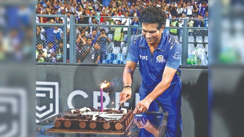 Sachin Tendulkar cuts a cake on Saturday