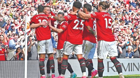 Manchester United players celebrate the opening goal