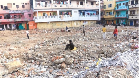 Kids playing on the Koyyathoppu ground filled with debris