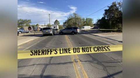 Law enforcement officers cordon off roads