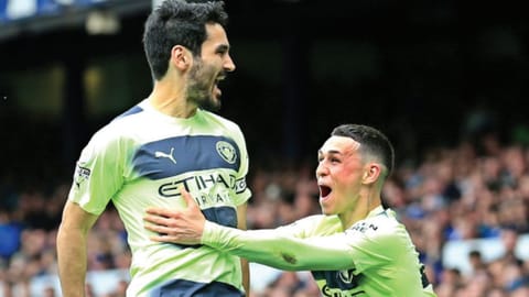 Ilkay Gundogan celebrates with Phil Foden after scoring Manchester City?s third goal against Everton