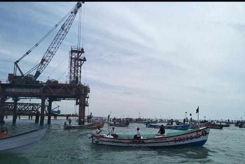 Fishermen lay siege to the coal jetty construction site near the shore near Kallamozhi
