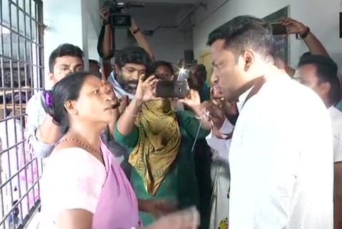 BJP MP candidate Anupam Hazra (R) at polling booth