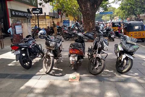 Bikes and cars parked on the pavement in Pondi Bazaar on Thursday