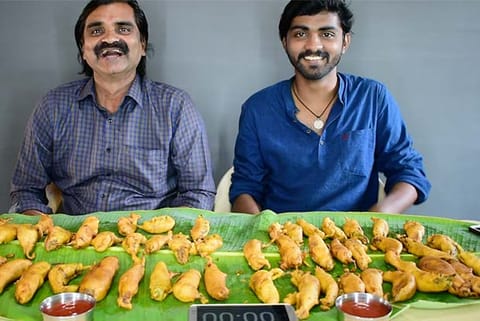 Porchezhiyan (left) and Sabari during an eating challenge