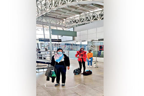 Passengers queue up for their flights at Chennai airport