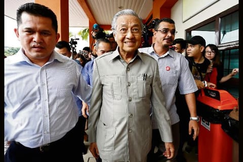 Malaysia's Mahathir proposes 'unity government' to strengthen grip