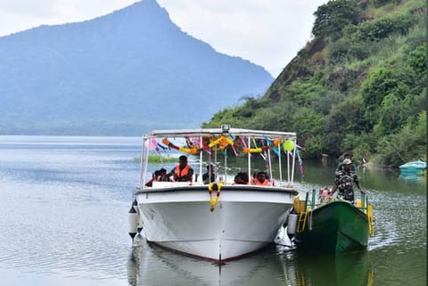 Tourists enjoying a ride on a solar-powered boat in Manimuthar dam in Tirunelveli district on Wednesday