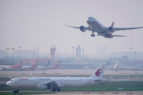 A China Eastern Airlines aircraft and Shanghai Airlines aircraft seen in Shanghai airport (Reuters)