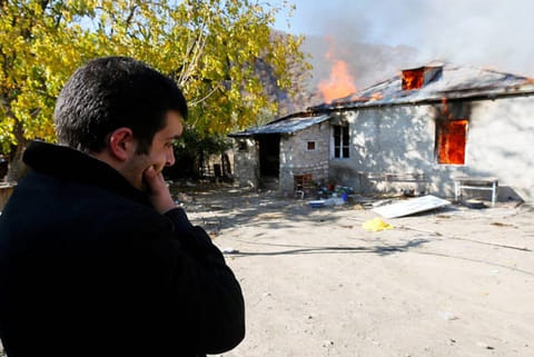 Armenians torch their homes on land ceded to Azerbaijan