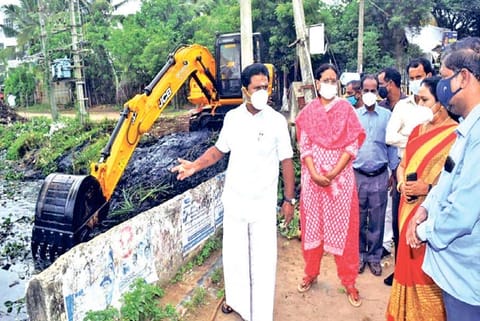 Minster R Kamaraj inspecting cleaning of a stormwater drains in Tiruvarur on Tuesday
