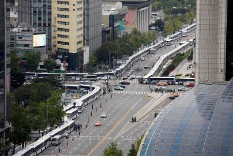 South Korea police set up 'bus walls' to prevent protests amid COVID-19 concerns