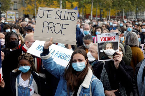 'Teaching yes, bleeding no': France pays tribute to beheaded teacher