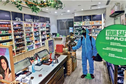 Staff sanitising shops inside a mall in the city on Tuesday