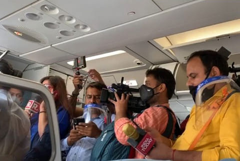 Scene inside a flight cabin during Kangana's travel