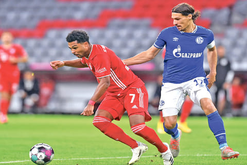 Bayern Munich winger Serge Gnabry (left) was the star of the show against Schalke, netting 3 goals