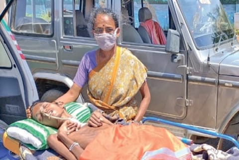 Lawrence Mary with her ailing son Stalin at Thanjavur Collectorate on Monday